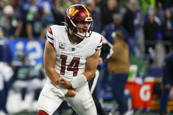 Nov 12, 2023; Seattle, Washington, USA; Washington Commanders quarterback Sam Howell (14) celebrates after throwing a touchdown pass against the Seattle Seahawks during the fourth quarter at Lumen Field.